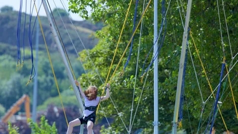 Bungee Trampoline Jump in the Highlands Stock Footage 317599169