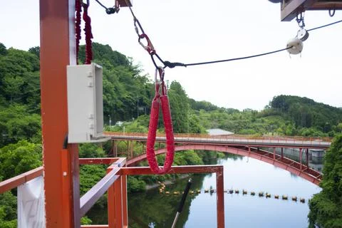 Bungie Jump cable hardware on platform above river Stock Photos