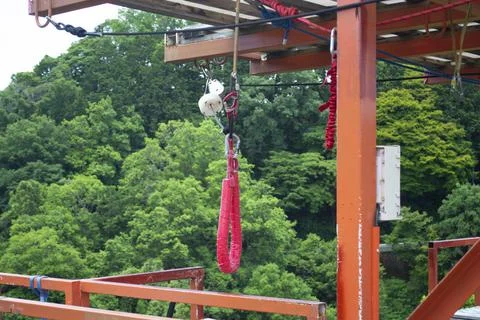 Bungie Jump cable hardware on platform above river Stock Photos
