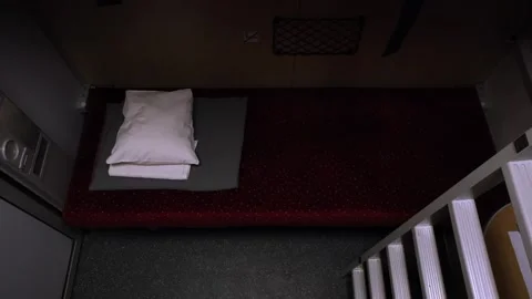Bunk bed inside a moving night train, top down establisher Stock Footage 305720854