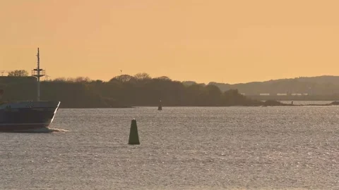 Bunker ship passing in low sunset light Video stock 276782492