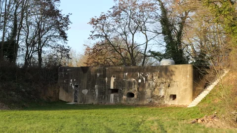 Bunker Wall with Shaped-Charge Damage - Eben-Emael Fortress, Sunny Day Stockbeeldmateriaal 331605302