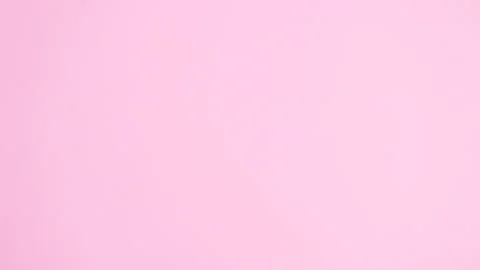 Bunny ears appear on different sides. Flat lay minimal Easter stop motion Stock Footage 149907811