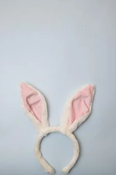 Bunny ears at bottom with copy space above on pastel blue background Fotos Stock