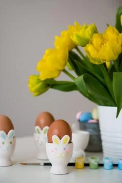 Bunny shaped Easter egg holder. vertical card for holidays Stock Photos