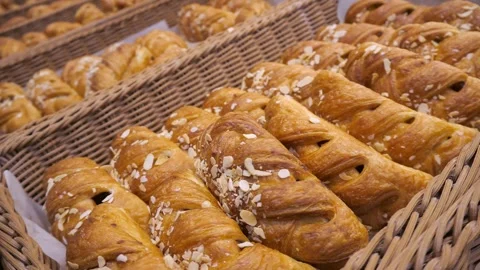 Buns with almonds, maple syrup and walnut filling, placed in wicker baskets. Stock Footage 302293547