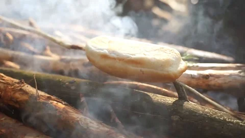 Buns are fried on the fire. Cooking at the stake. Stock Footage 106467864