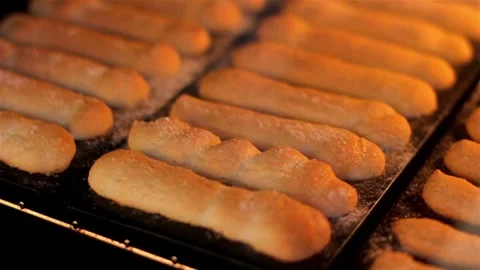 Buns baking in oven. Timelapse. Buns for hamburger rising up in oven. Baking Stock Footage 272449264