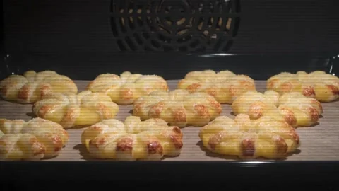 Buns baking in oven. Timelapse. Buns for hamburger rising up in oven. Baking Stock Footage 336576785