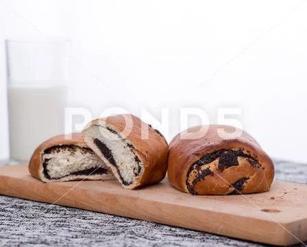 Buns with poppy seeds on a plate Stock Photos