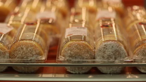 Buns with powdered sugar on the shelf Video stock 59869757