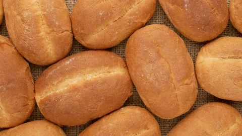 Buns sprinkled with flour. Baking on burlap. Stock Footage 143194743