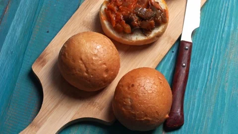 Buns with squash caviar rotates on a turntable, top view Stock Footage 159439989