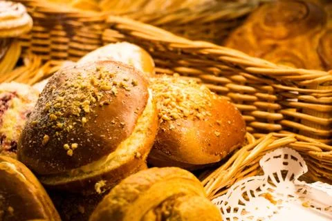 Buns with stuffing and pieces of nuts and sugar powder Stock Photos