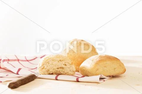 Buns with a towel and a knife Stock Photos