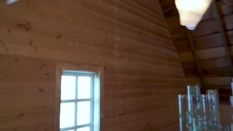 Bunting and string lights over wedding cake in barn Vídeo Stock 220457943
