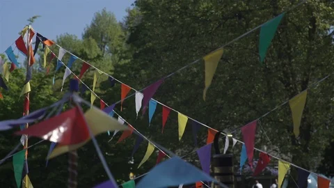 Bunting - multicoloured - flags fluttering in gentle breeze Stock Footage 93200575