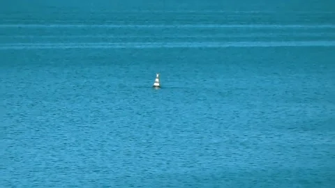 The buoy bobs on the waves Stock Footage 131069009