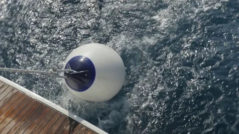 Buoy floating behind Boat Stock-Footage 79658730