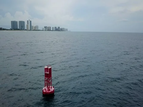 Buoy Floating In The Ocean With West Palm Beach Skyline In The Back Stock-Footage 79447057