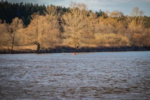Buoy on a navigable river, warning of danger to ships Stock Photos