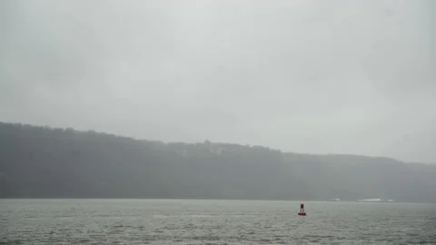 Buoy in River on Rainy Day Stock Footage 169772877
