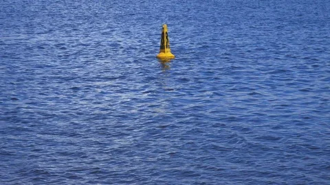 Buoy with speed markings floating in a river Stock Footage 94530736