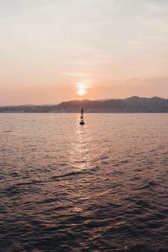 Buoy   at   sunset Stock-Fotos