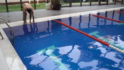 Burak 35 swimmer making the start dive Stock Footage 99830099