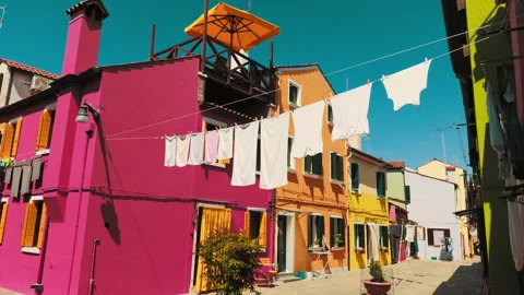 Burano laundry strung above vivid colorful houses Stock Footage 336711575