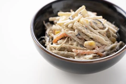 Burdock salad on a white background Stock Photos