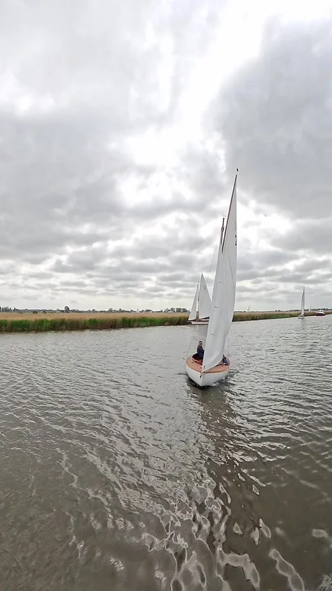 Bure One design white boat on the River Bure, Norfolk Broads Video stock 314559050