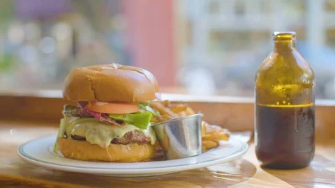 Burger and drink on table Stock Footage 87805992