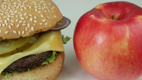 Burger and red apple Stock Footage 241819366