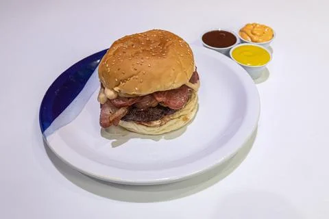 Burger with bacon and sauces studio shot Foto stock