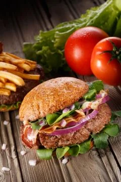 Burger with bacon close up. Stock Photos