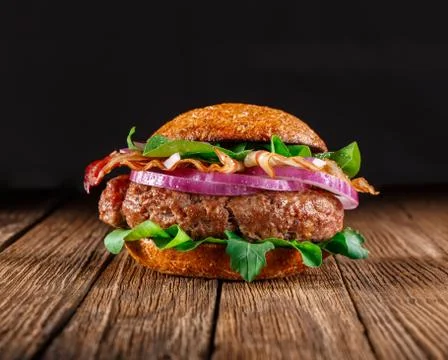 Burger with bacon close up. Stock Photos