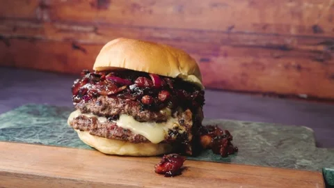 Burger with Bacon Jam and Red Onion Stock Footage 325820905
