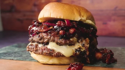 Burger with Bacon Jam and Red Onion Stock Footage 325820912
