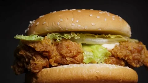 Burger with beef and vegetables rotates. cutlet, Hamburger with fries rotated on Stock Footage 336578489