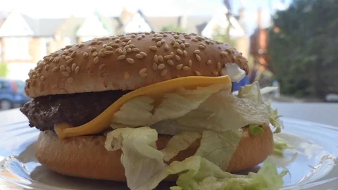 Burger with beef, cheese and salad. Stock Footage 82218409