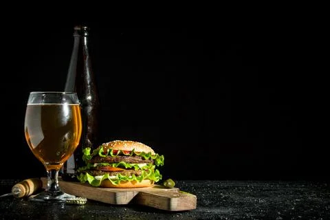 Burger with beer. Stock Photos