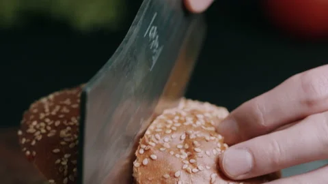 Burger Being Cut On The Half With A Sharp Knife Video stock 134417448