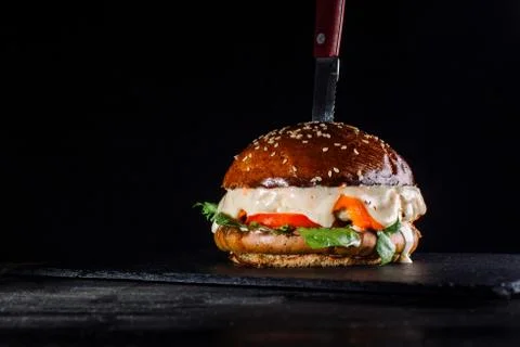 A burger on the black background with an angle view-2. Stock Photos