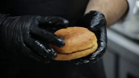 Burger bread in the hands Stock Footage 127202144