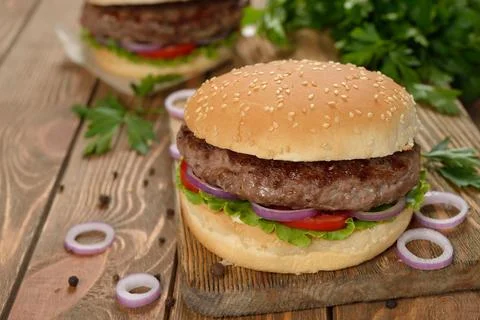 Burger on a brown background Stock Photos