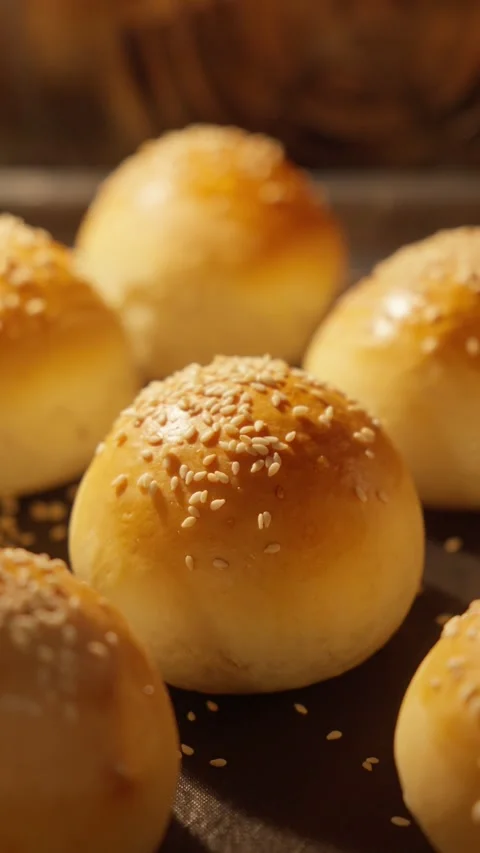 Burger buns baked in oven. Process of making burger buns in restaurant kitchen. Stock Footage 291629206
