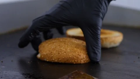 Burger buns toasted on the grill. Preparing of the burger Stock Footage 86177418