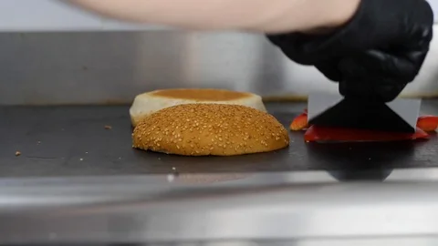 Burger buns toasted on the grill. Preparing of the burger Stock Footage 86177854