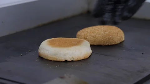 Burger buns toasted on the grill. Preparing of the burger Stock Footage 86178538